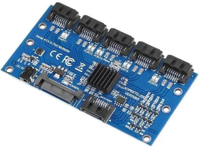Green circuit board with one SATA input and five SATA output ports