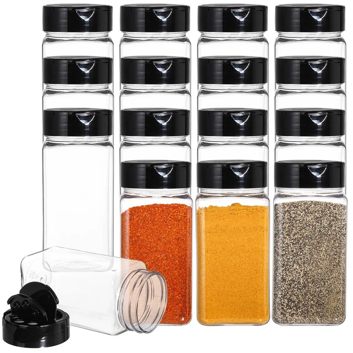 Sixteen clear square plastic spice jars with black flip-top caps