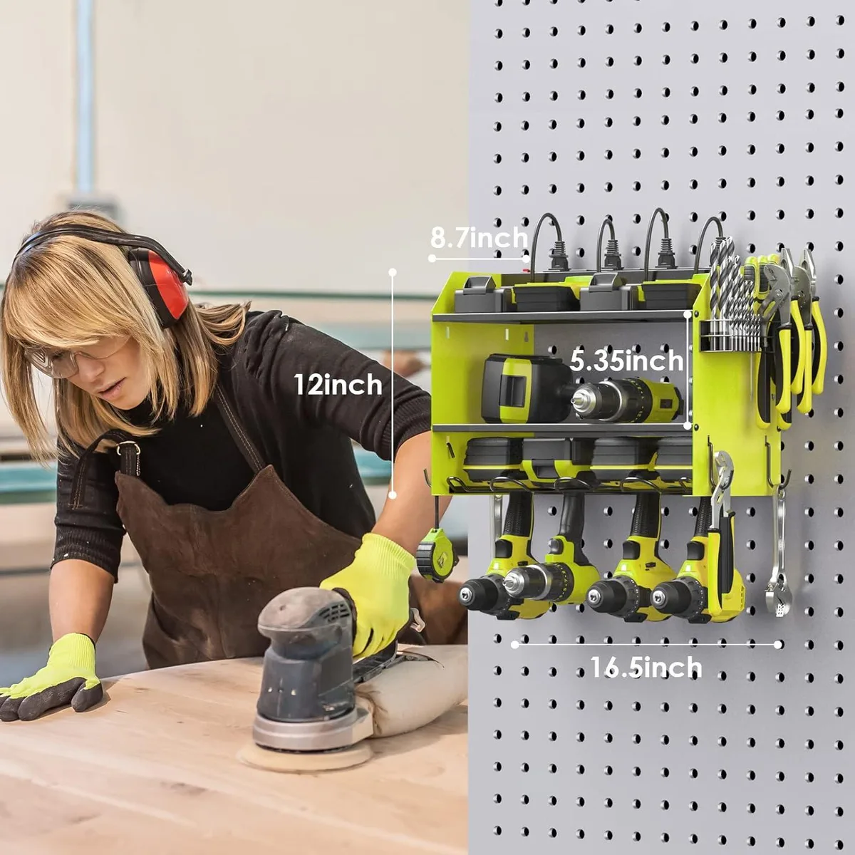 Green modular wall-mounted tool organizer with built-in power strip, four drill slots, hooks and bit rack