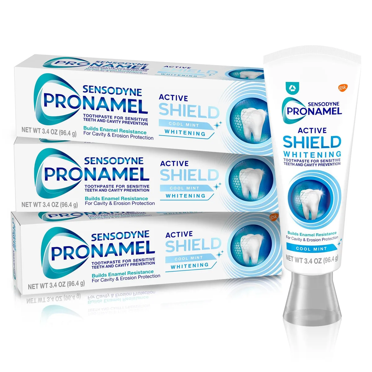 Three white 3.4 oz toothpaste tubes with blue caps and silver lettering