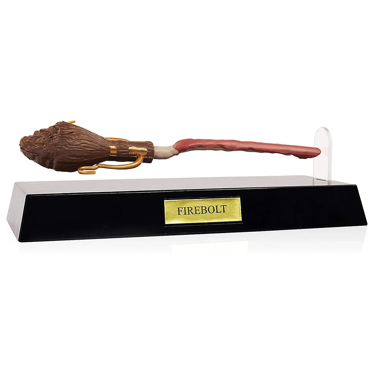 A broomstick-shaped pen hovering above a display base with a brass plaque