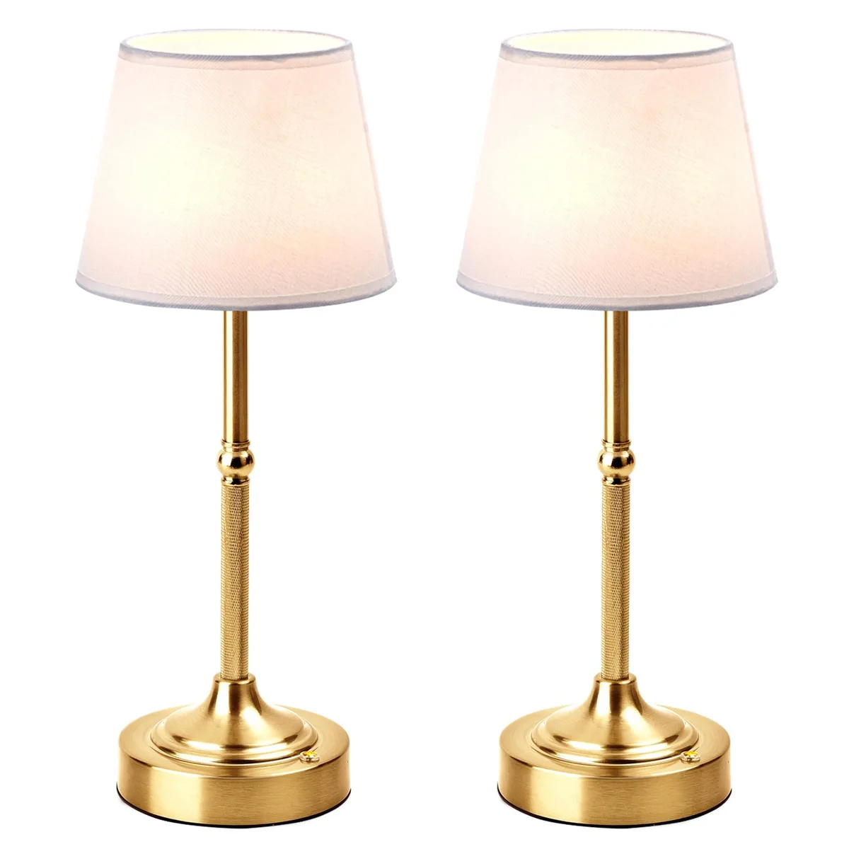 Two brushed gold cordless table lamps with linen shades, compact and portable