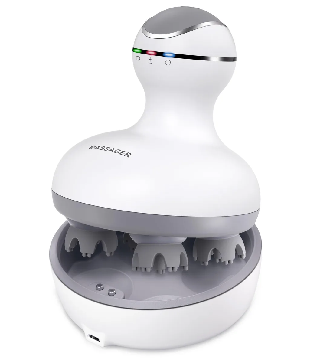 White handheld cordless scalp massager with four kneading heads, magnetic charging base visible