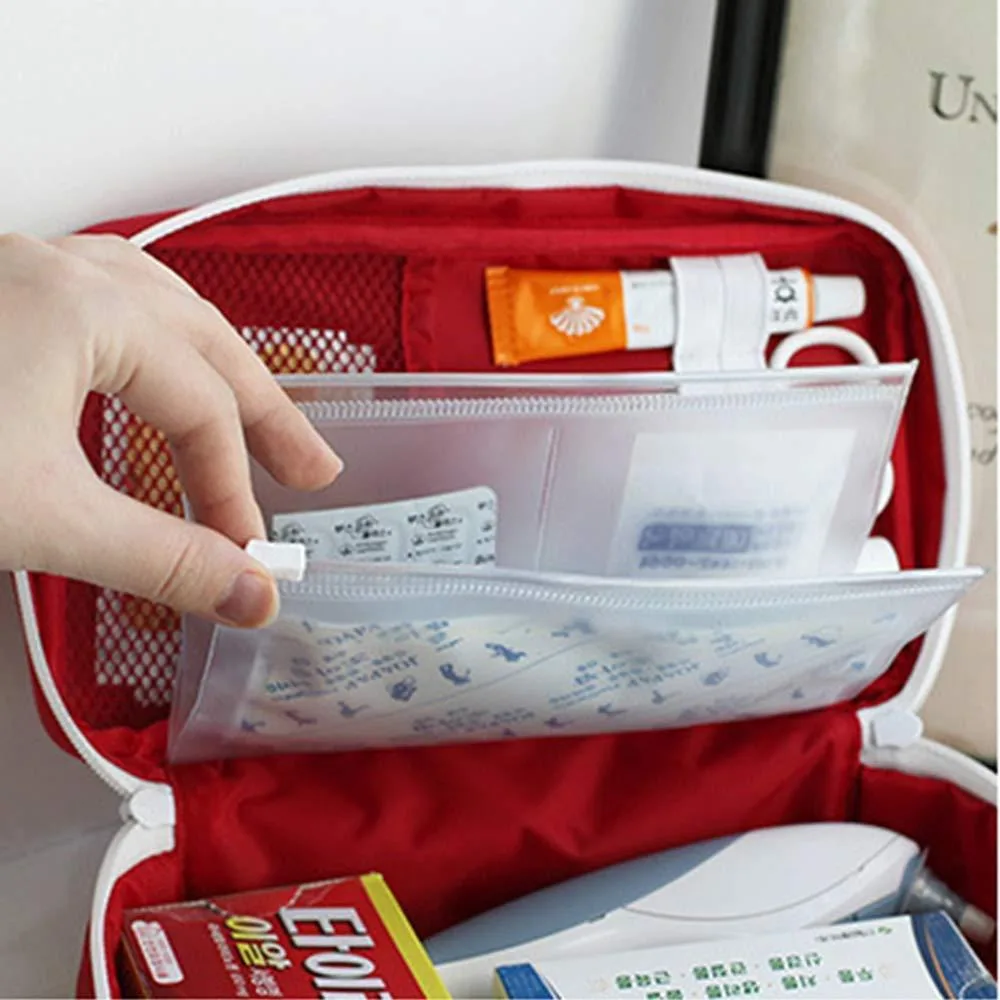 Red polyester first aid bag, rectangular with zip closure and carry handle
