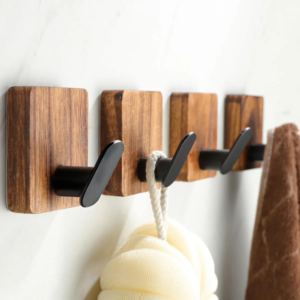 Four natural carbonized wood adhesive wall hooks with metal tips