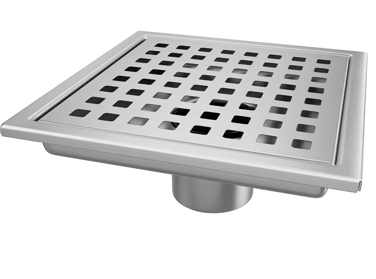 Twelve square shower drains in satin stainless steel finish