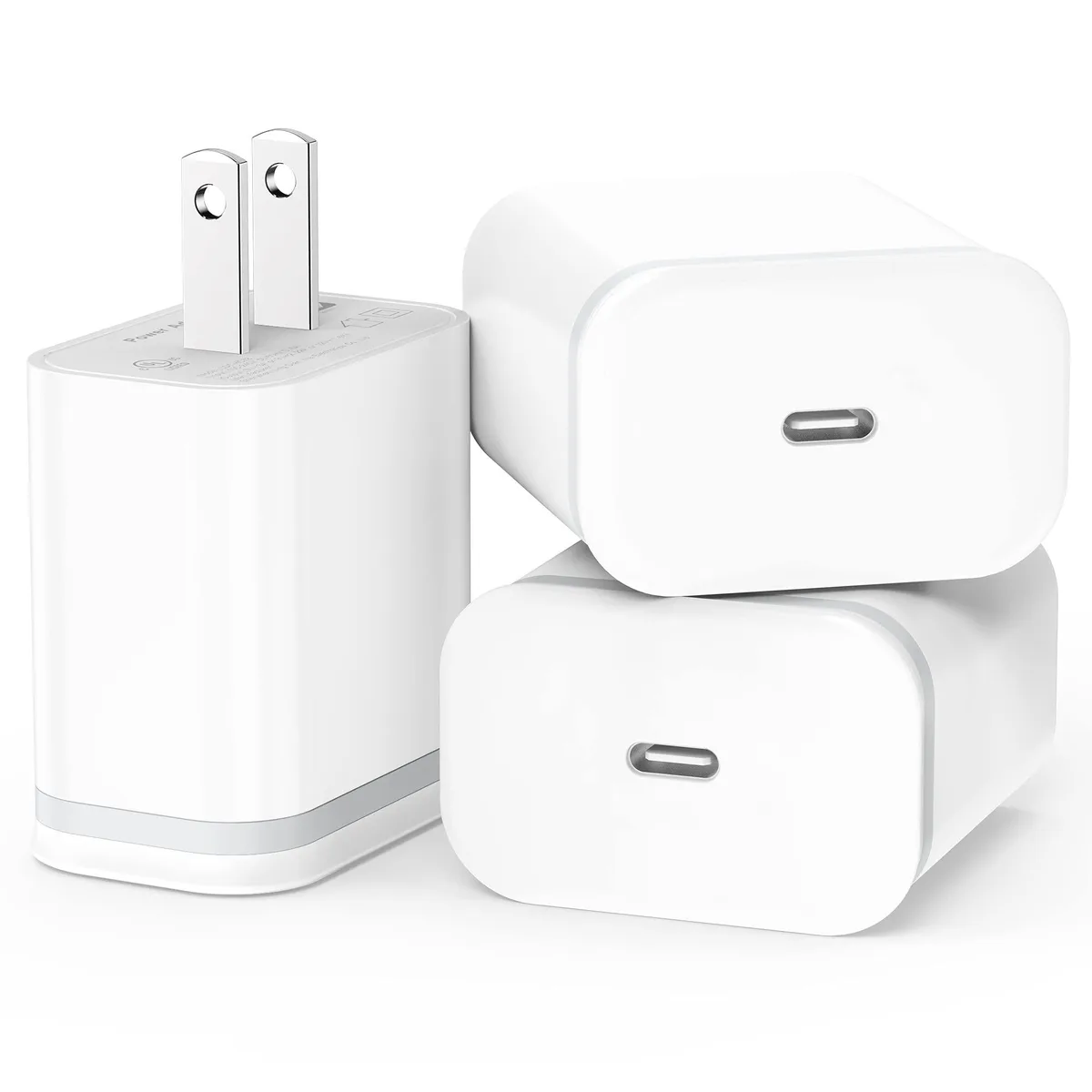 Three small white USB-C wall chargers with a single port each