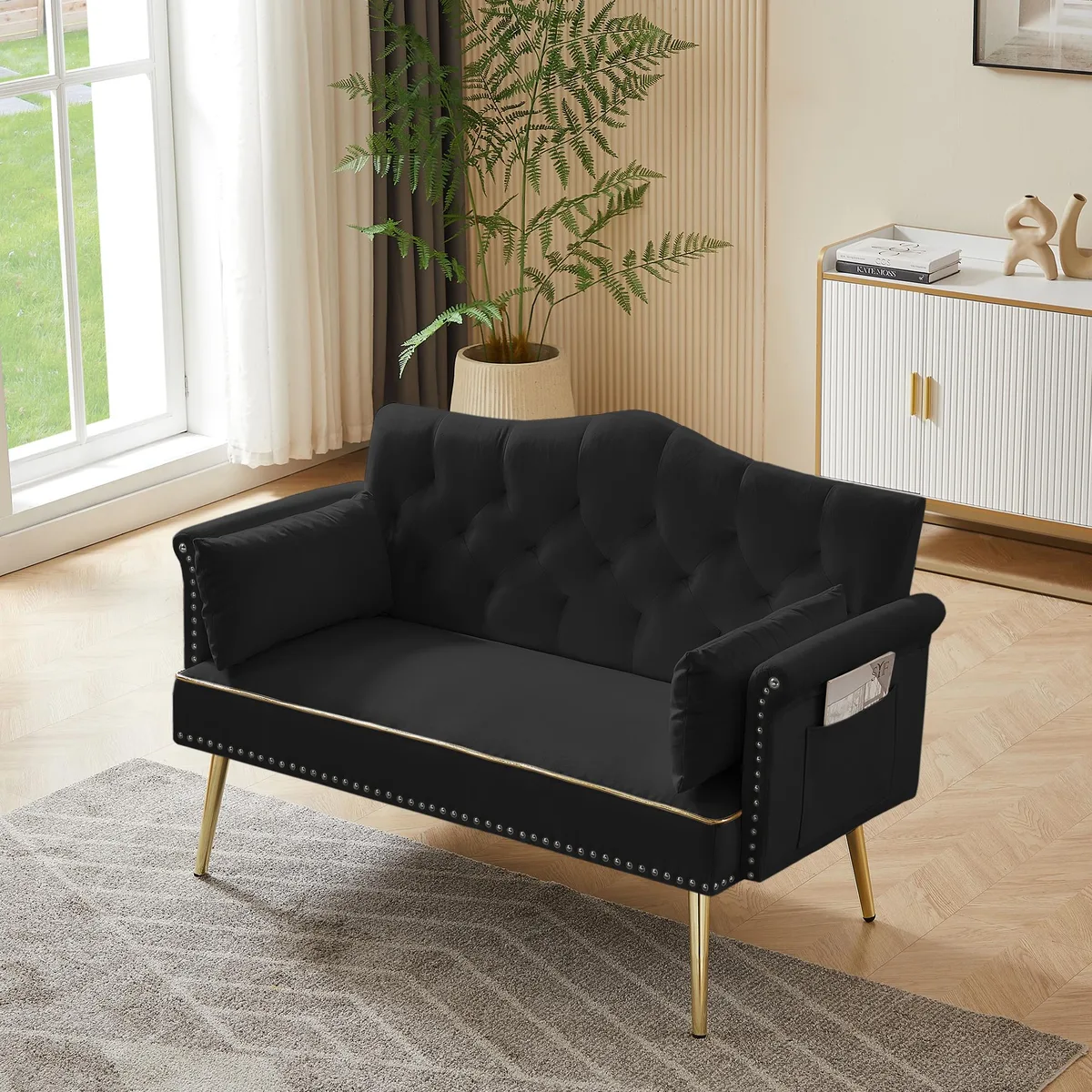 Black velvet loveseat with tufted back and seat, four metal legs