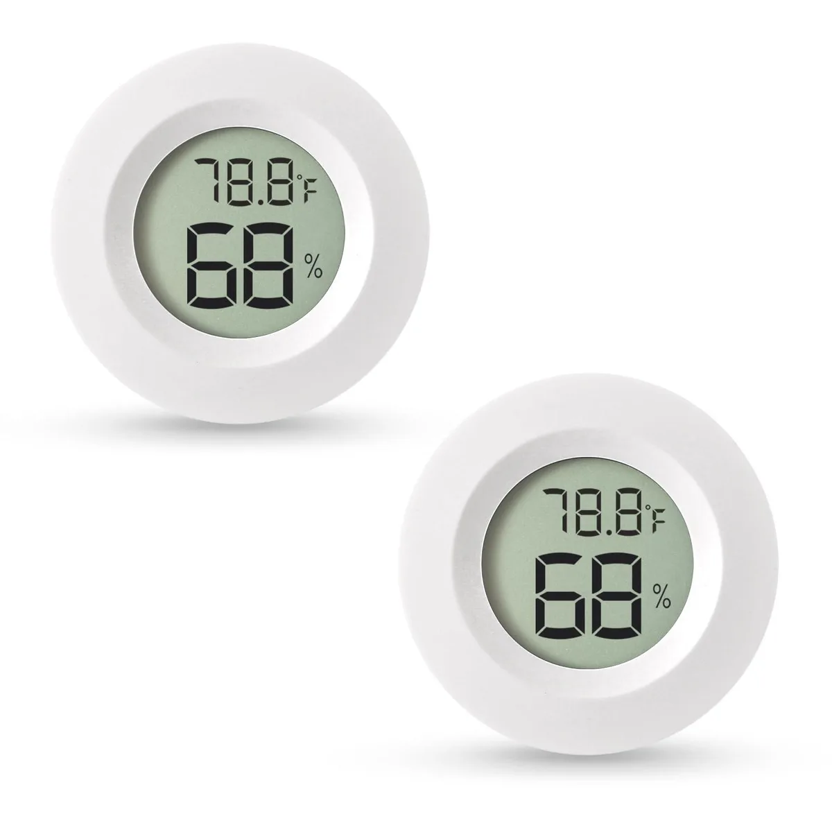 Two small white square hygrometer thermometers with digital displays side by side