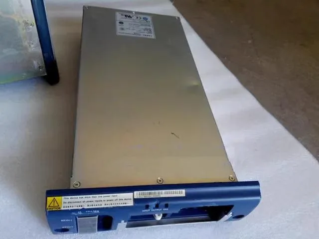 Rectangular silver server power supply unit with front handle and ventilation grille