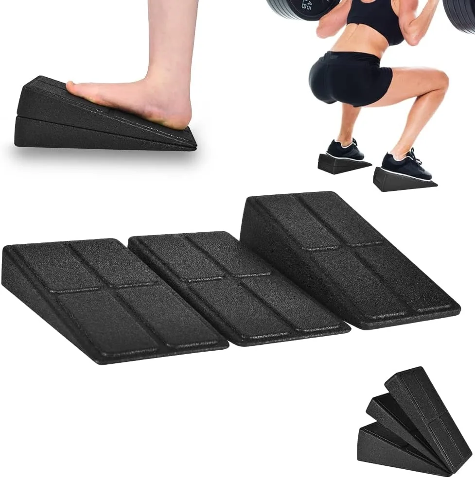 Three lightweight foam wedges, two low and one tall, charcoal grey, stackable for adjustable angles