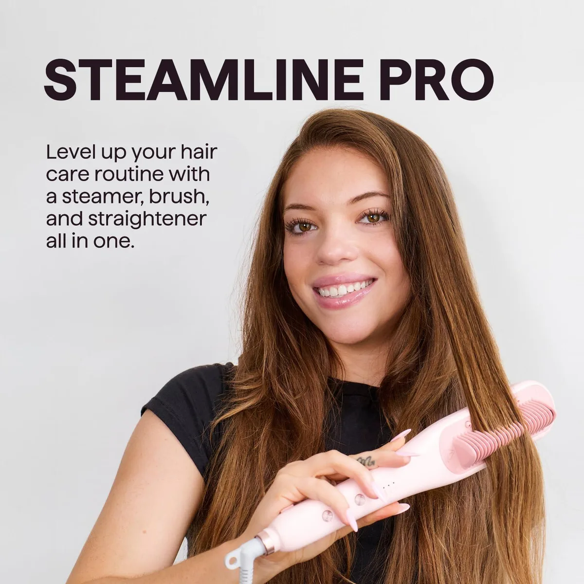 A white and gold hair straightener brush with steam vents and bristles