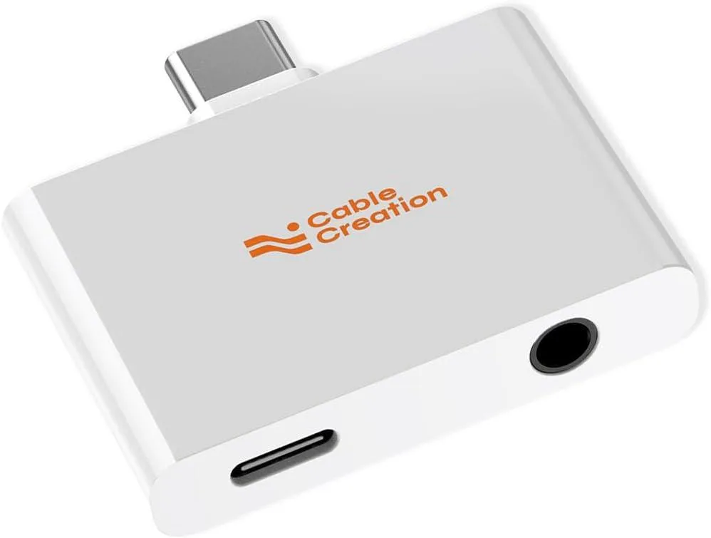 Compact USB-C dongle with 3.5 mm jack and USB-C charging port