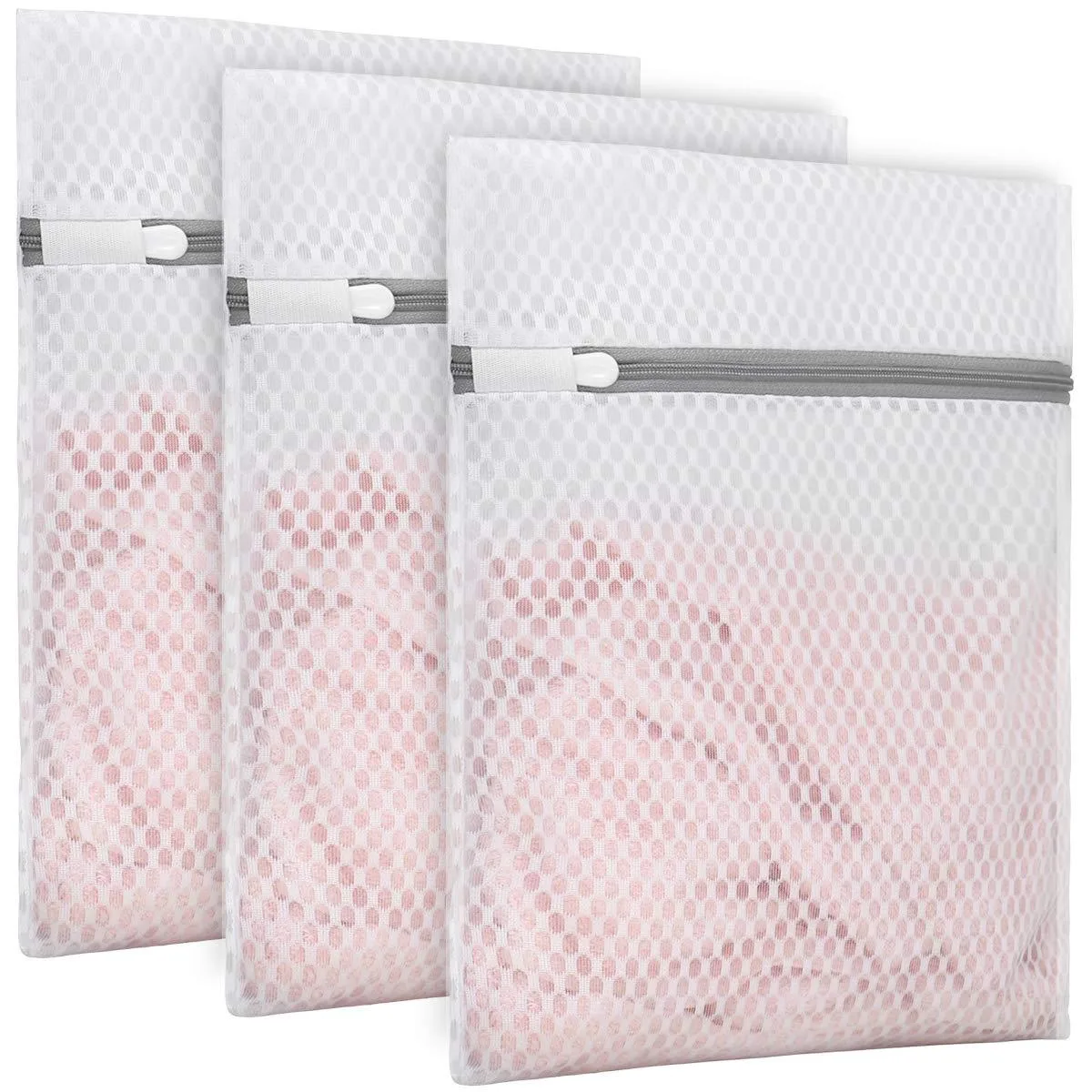 Three beige honeycomb mesh laundry bags with zippers, medium size