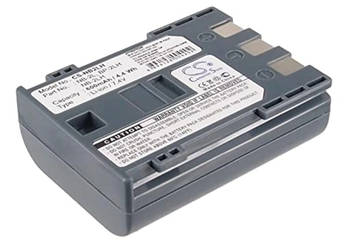 Small rectangular Canon-compatible camera battery, dark grey plastic, gold contacts visible
