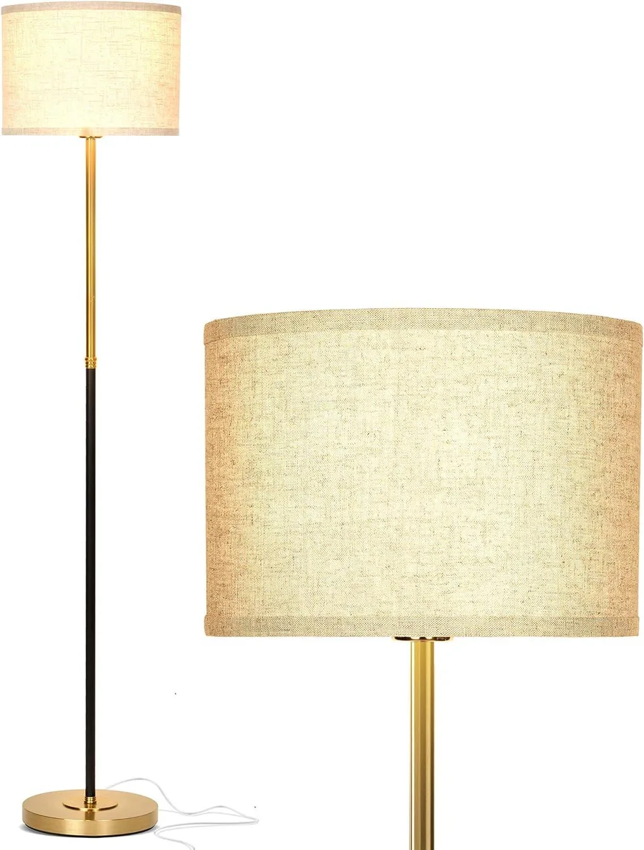 Tall brass floor lamp with white drum shade