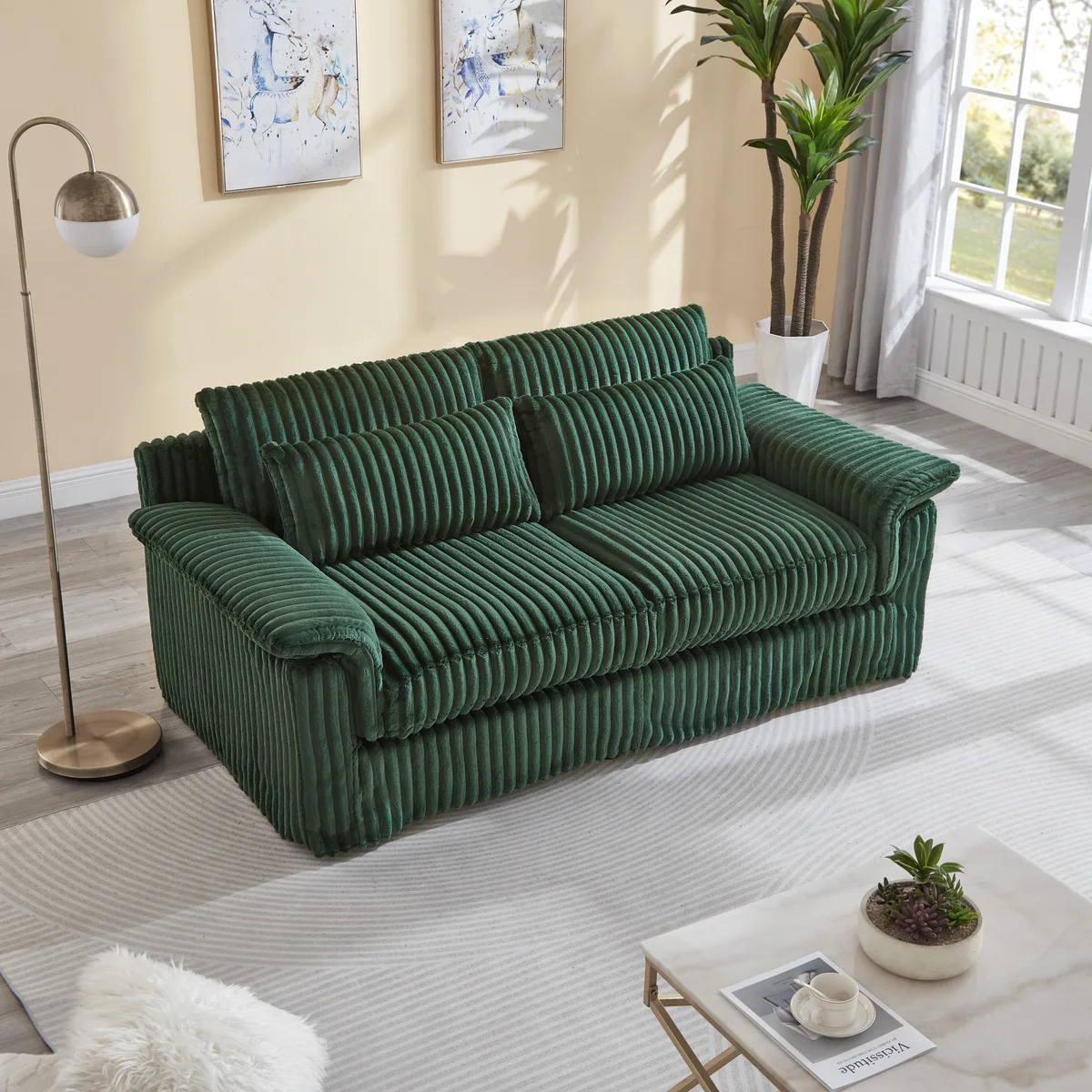 Dark green corduroy two-seater loveseat with removable cushions, low profile