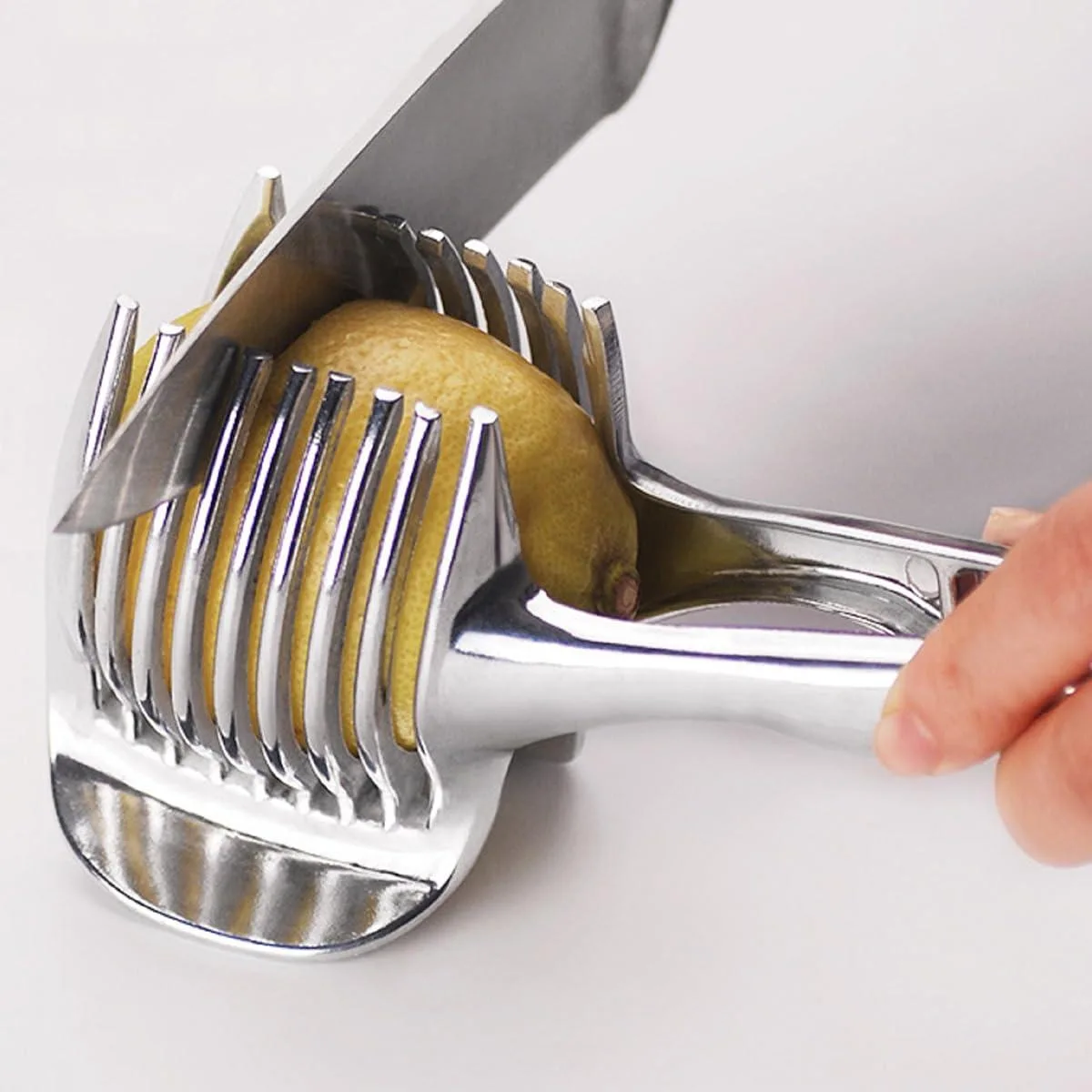 Silver aluminium tomato and lemon slicer, 18 by 6 cm, ergonomic handle