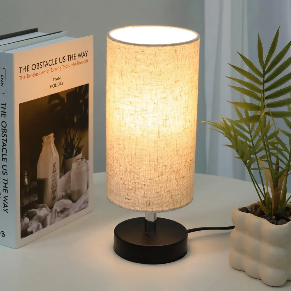 Small matte-finish table lamp with linen shade, 13 inches high