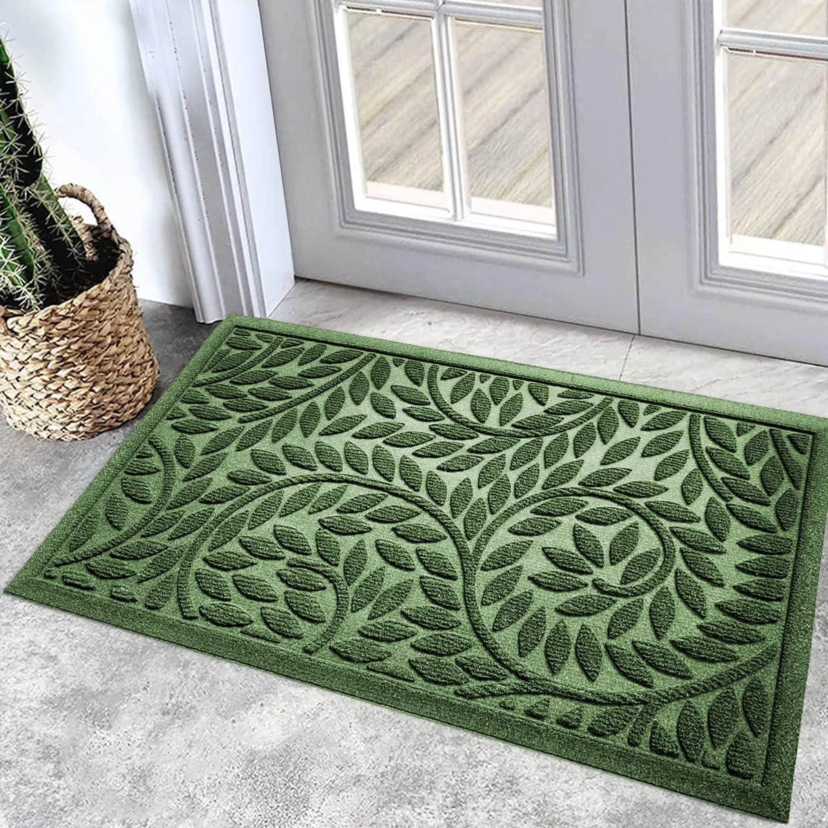 Green rectangular door mat with leaf pattern, rubber backing, 17 by 30 inches