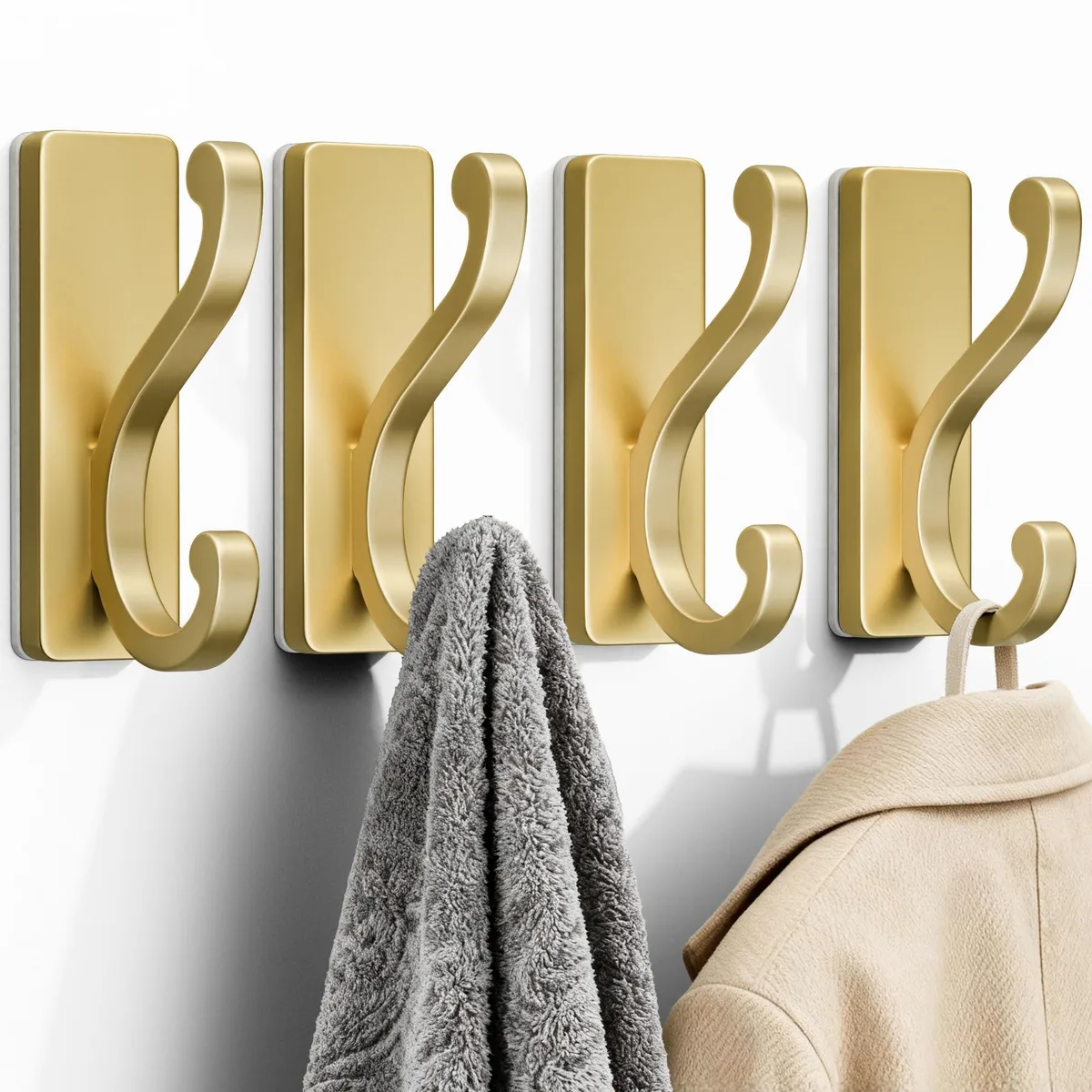 Four gold aluminum double hooks with adhesive backing