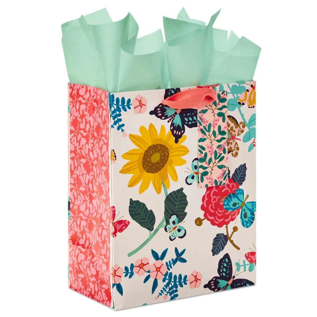 Three medium paper gift bags with bright floral prints on all sides, satin handles, and light green tissue paper included
