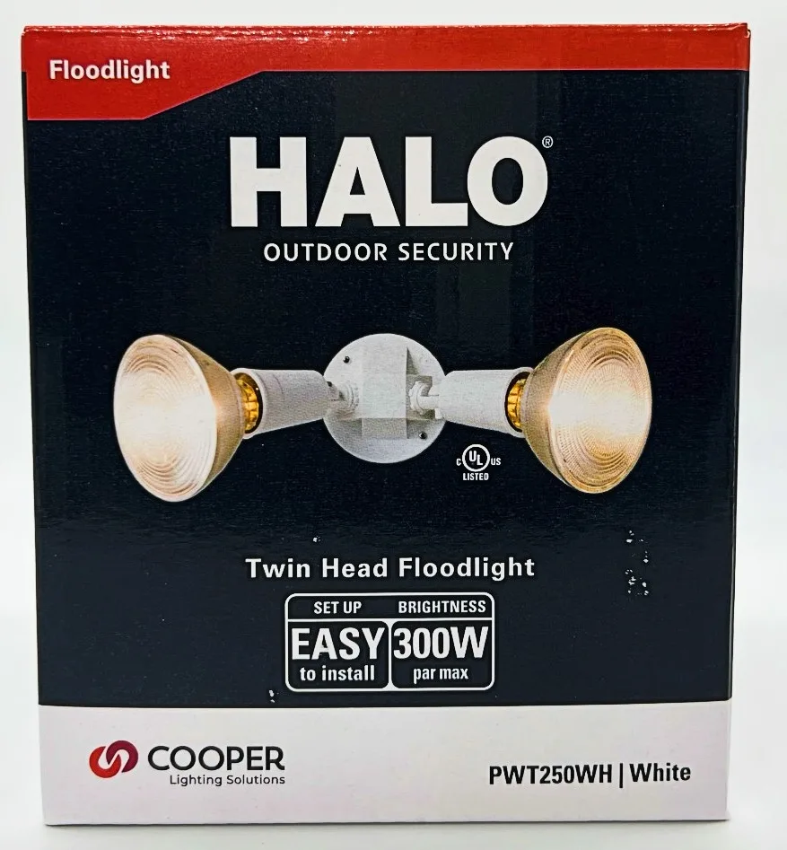 White plastic twin floodlight fixture with two adjustable lamp heads, weatherproof housing, eave-mount base