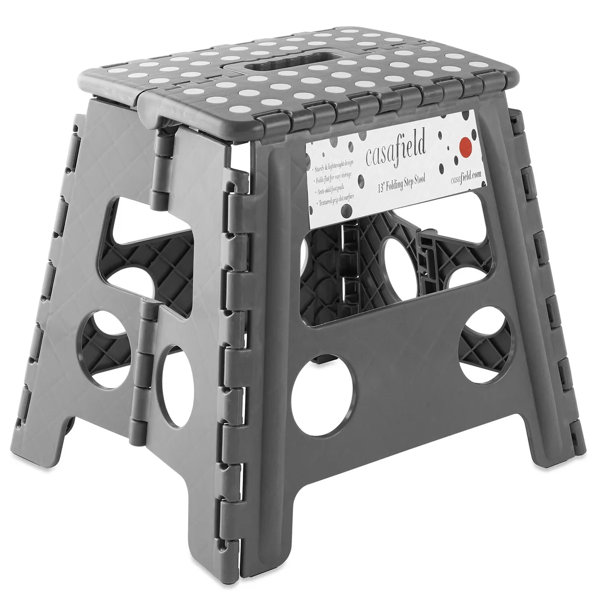 Gray plastic folding step stool with carry handle, textured top and anti-skid feet, folds flat to 1.5 inches deep