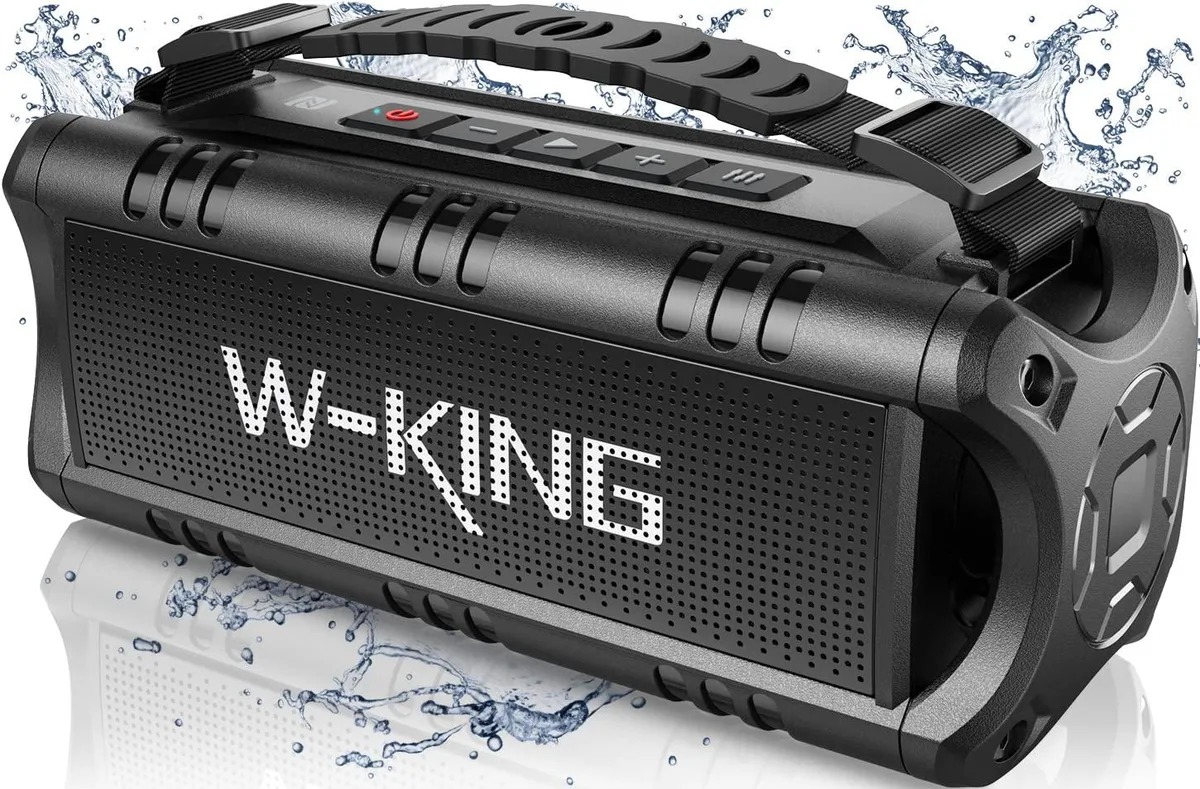 Black rectangular Bluetooth speaker with rounded edges and removable carrying strap