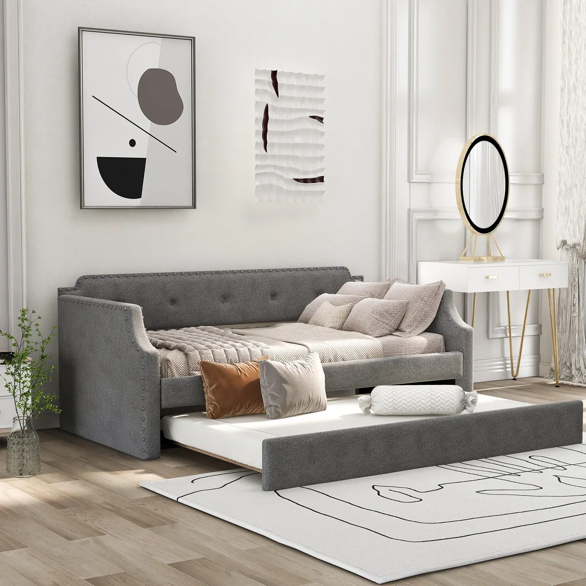 Gray linen upholstered twin daybed with pull-out trundle and wood slats
