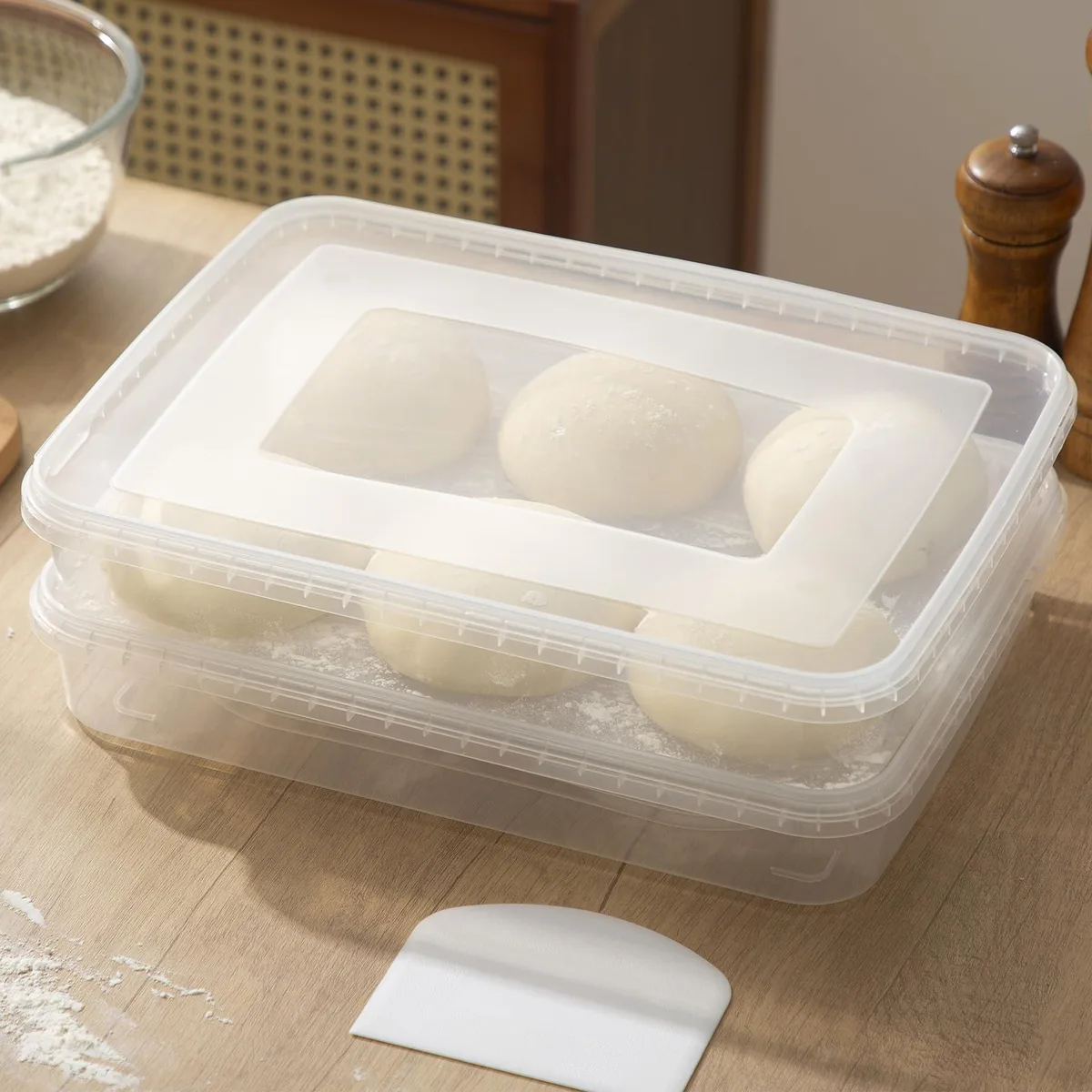 Two red rectangular silicone proofing boxes with transparent lids stacked together