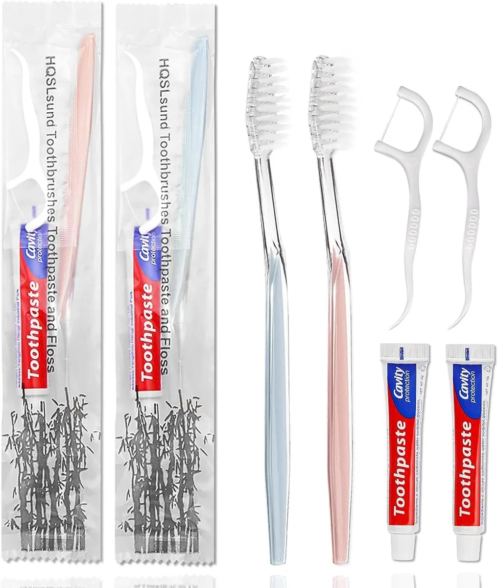 Bulk pack of 100 pink and blue disposable toothbrushes with toothpaste and floss