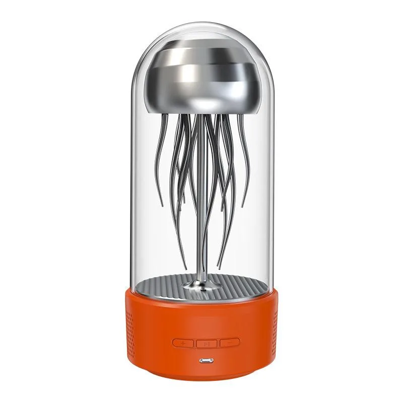 Orange jellyfish-shaped Bluetooth speaker in glass dome, 24x11cm