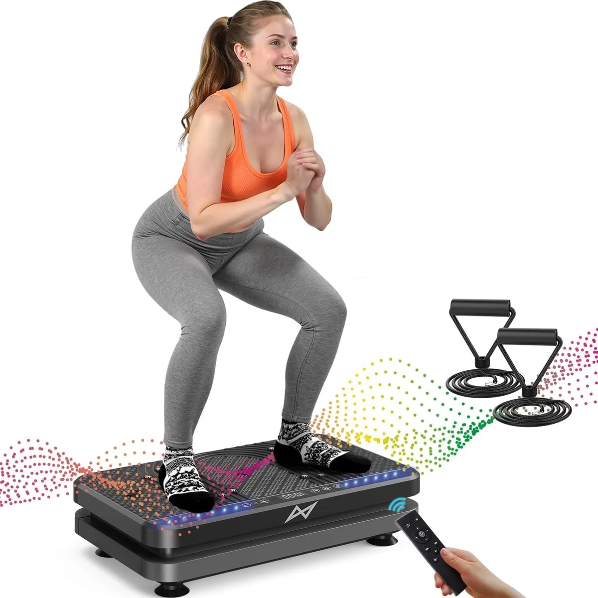 Black rectangular vibration platform with textured surface, remote control and two resistance bands attached
