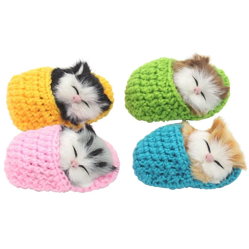 Four multicoloured plush cats sleeping inside slippers, each about three and a half inches long
