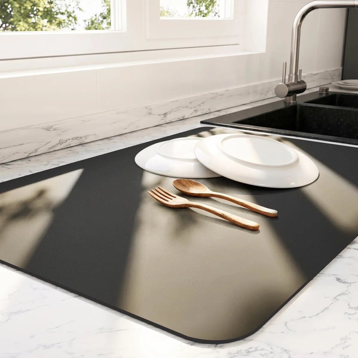 Black rectangular kitchen mat with textured surface and rubber backing, sixteen by twenty inches