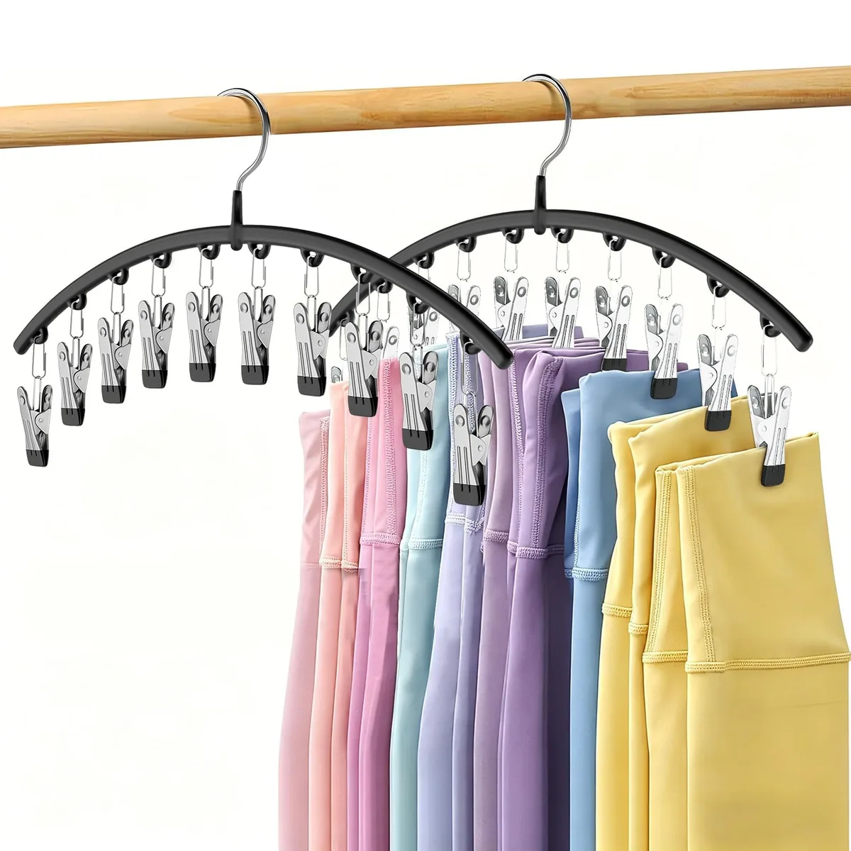 Two black metal hangers each with ten clips holding leggings
