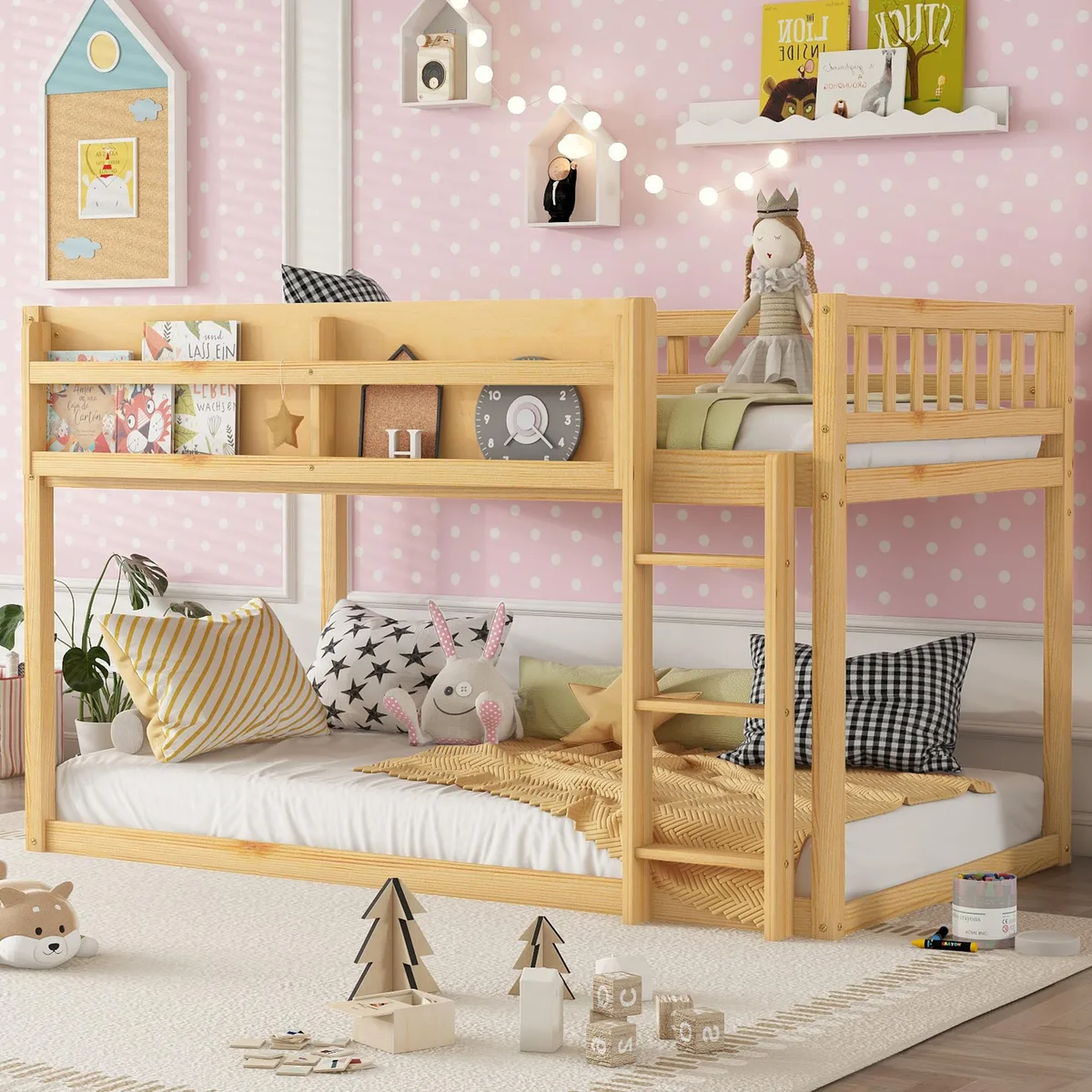 Low twin-over-twin bunk bed in natural wood finish with ladder and guardrails