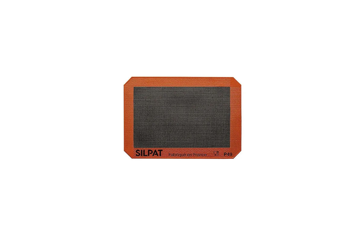 Orange silicone quarter-size baking mat, flexible rectangular sheet with smooth non-stick surface