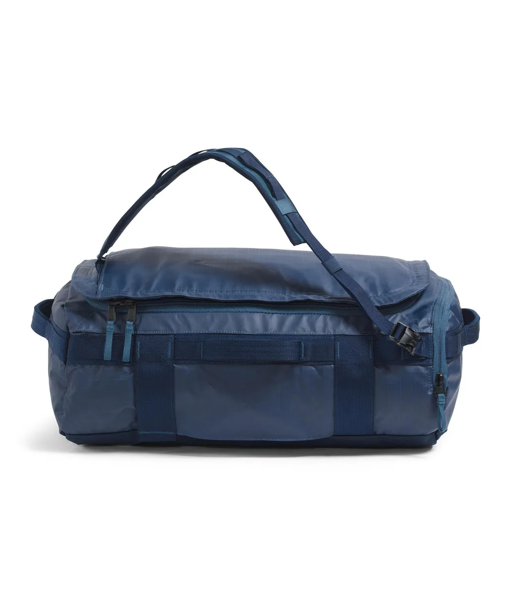 Shady blue and navy duffel bag with stowable backpack straps and external laptop pocket