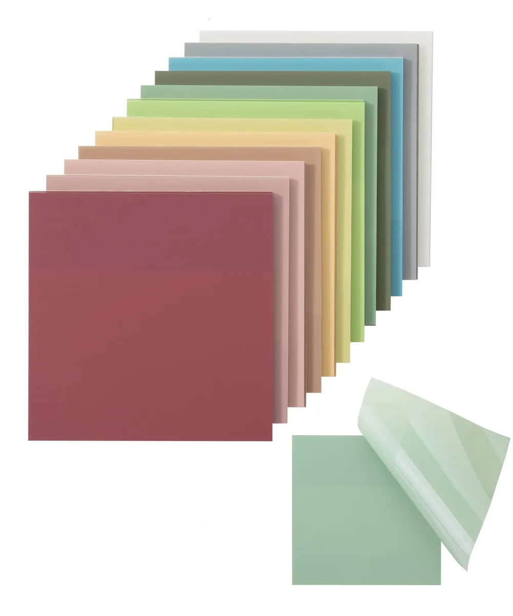 Twelve square pads of translucent vintage-tinted sticky notes in a rectangular pack