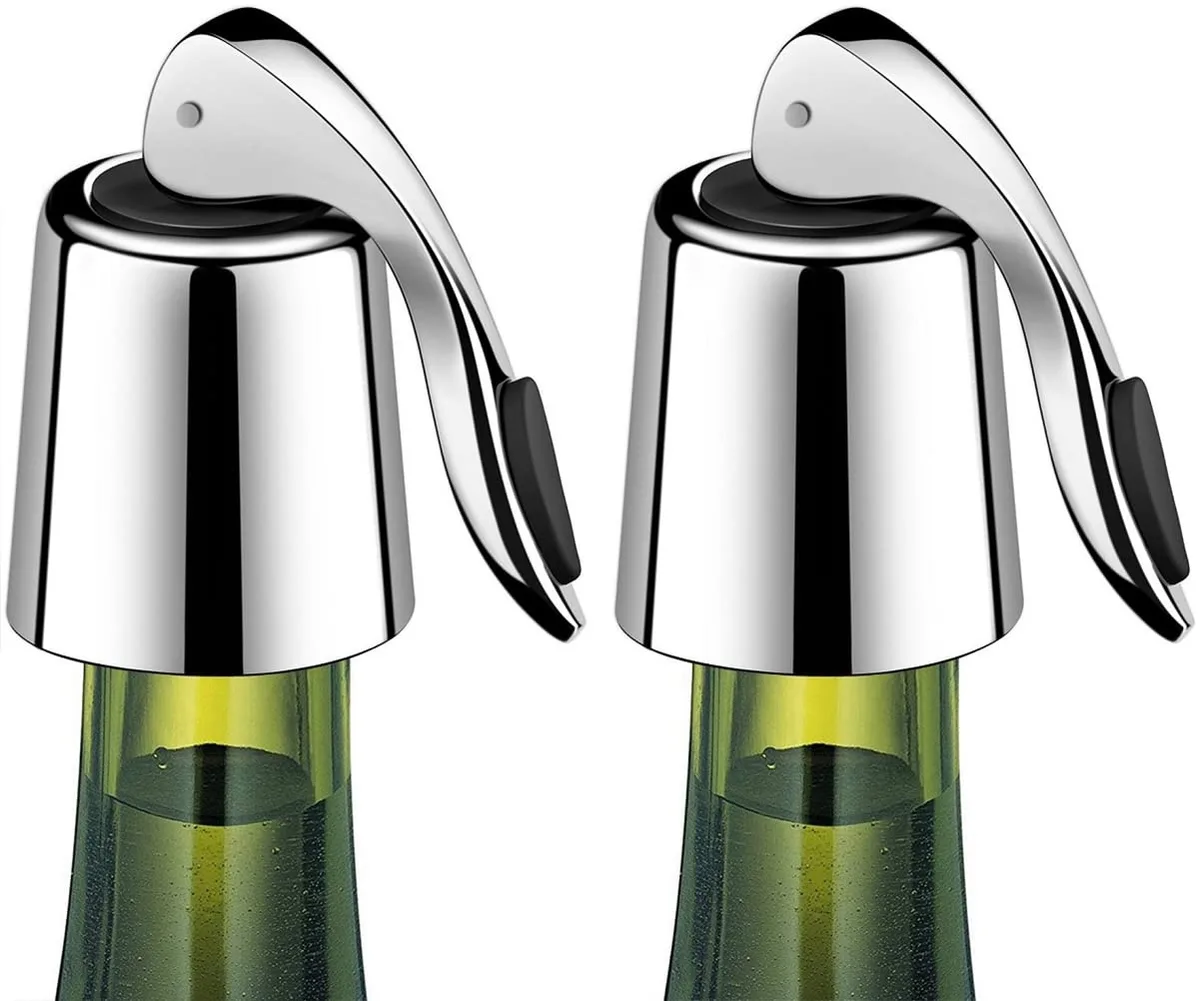 Seven black wine stoppers with stainless steel shafts and silicone seals standing upright