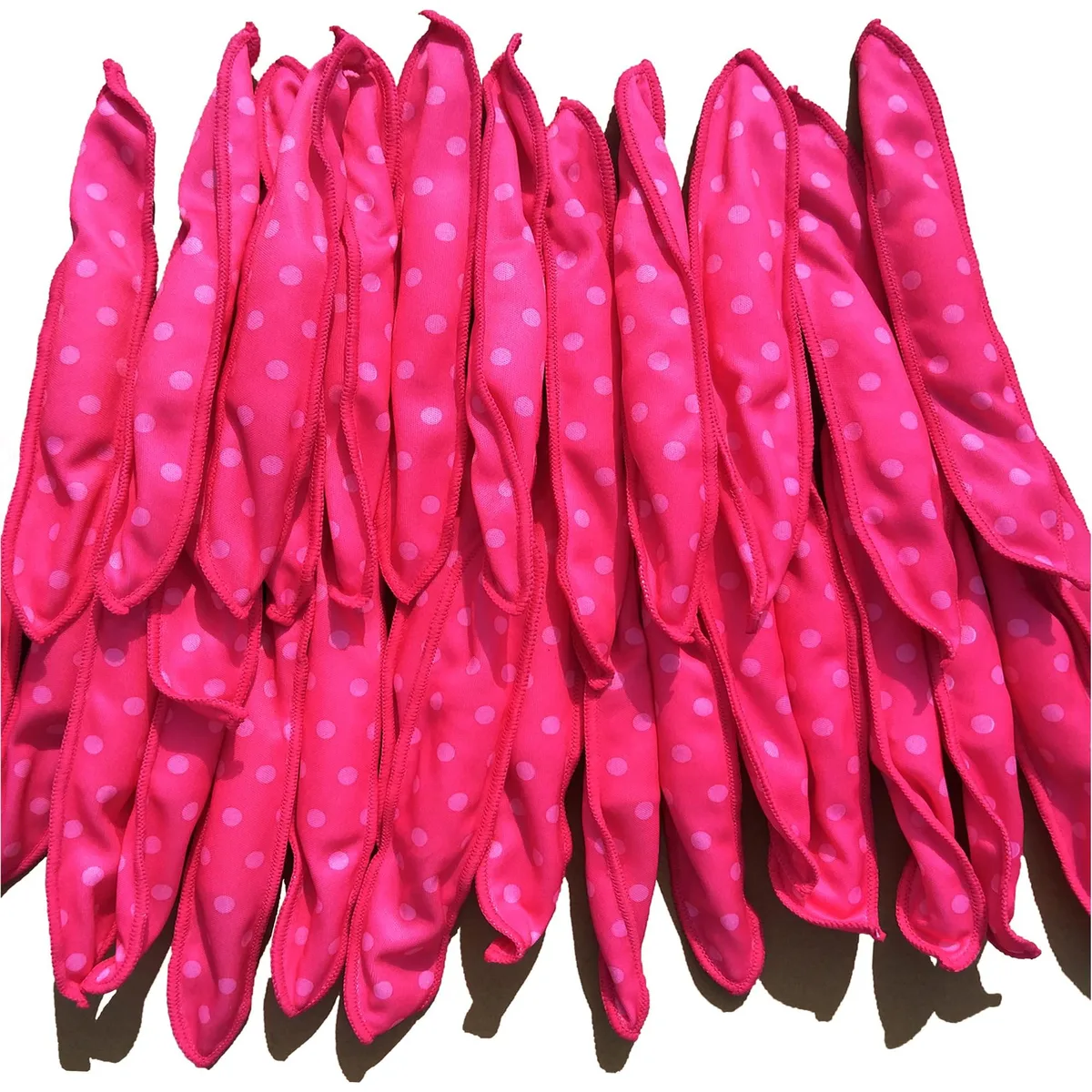 Twenty pink soft foam sponge curlers in a set