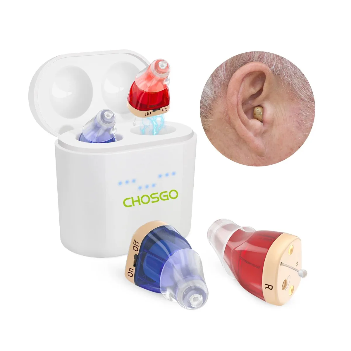 A pair of tiny red and blue in-ear hearing aids with a compact charging case