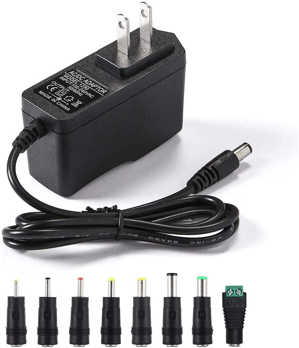 Black Dell power adapter with eight interchangeable barrel tips and a six-foot cord