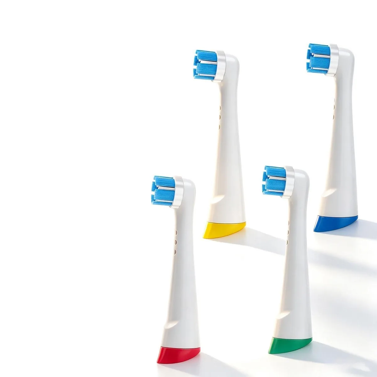 Four white Oral-B iO compatible brush heads with medium bristles in individual wrapping
