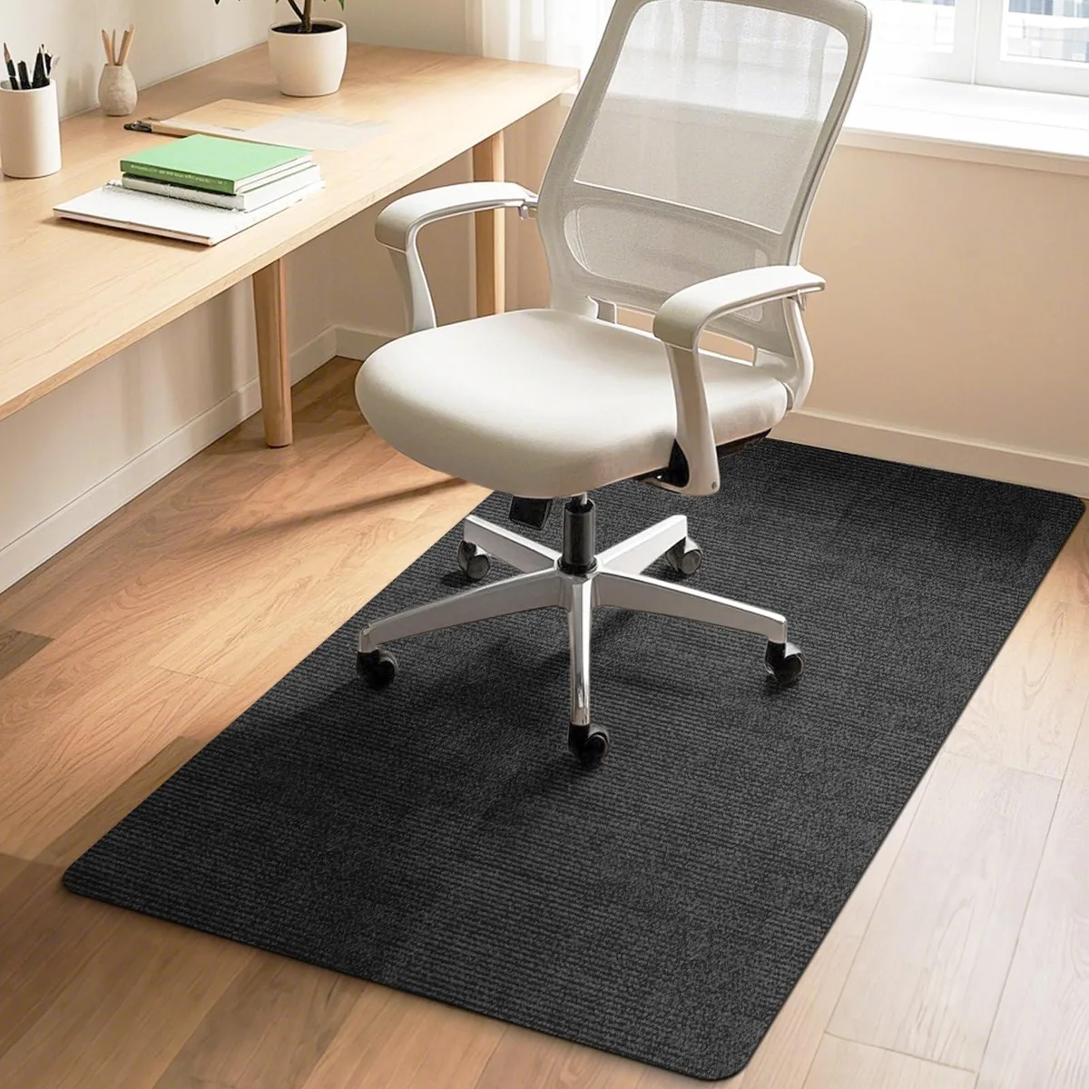 Rectangular slate-black chair mat, 48 by 36 inches, low-profile polyester surface with leather finish