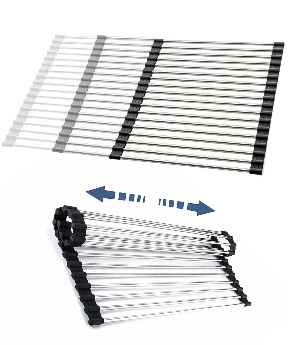 Red expandable roll-up drying rack with stainless steel tubes and silicone base, shown extended over a sink
