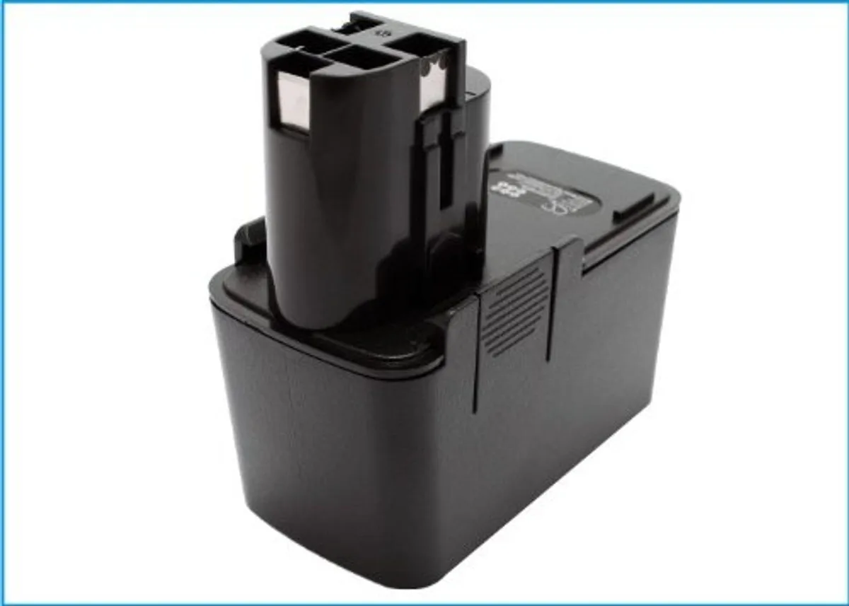Rectangular black power-tool battery with raised contacts and label