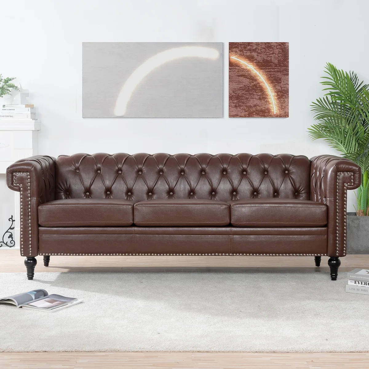 Dark brown three-seater sofa with square arms, silver stud trim, removable cushions and gourd-shaped birch legs
